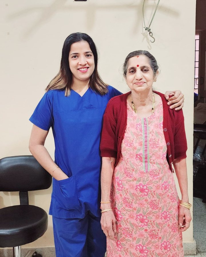 Physiotherapist with an elderly patient at the clinic